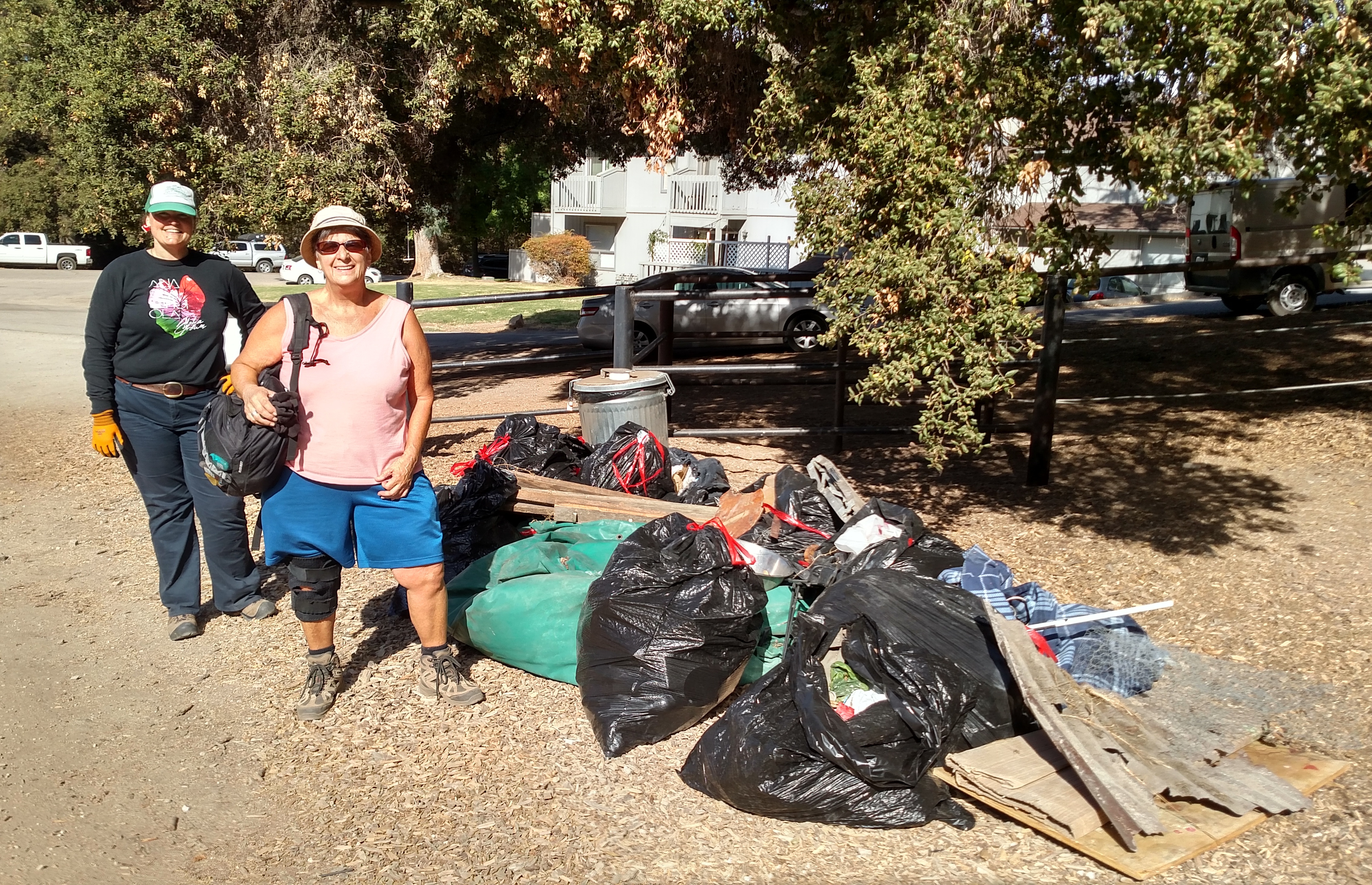 Amber and Kathy with the trash pile!